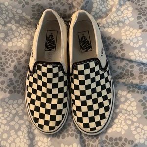 Black checkered slip on vans